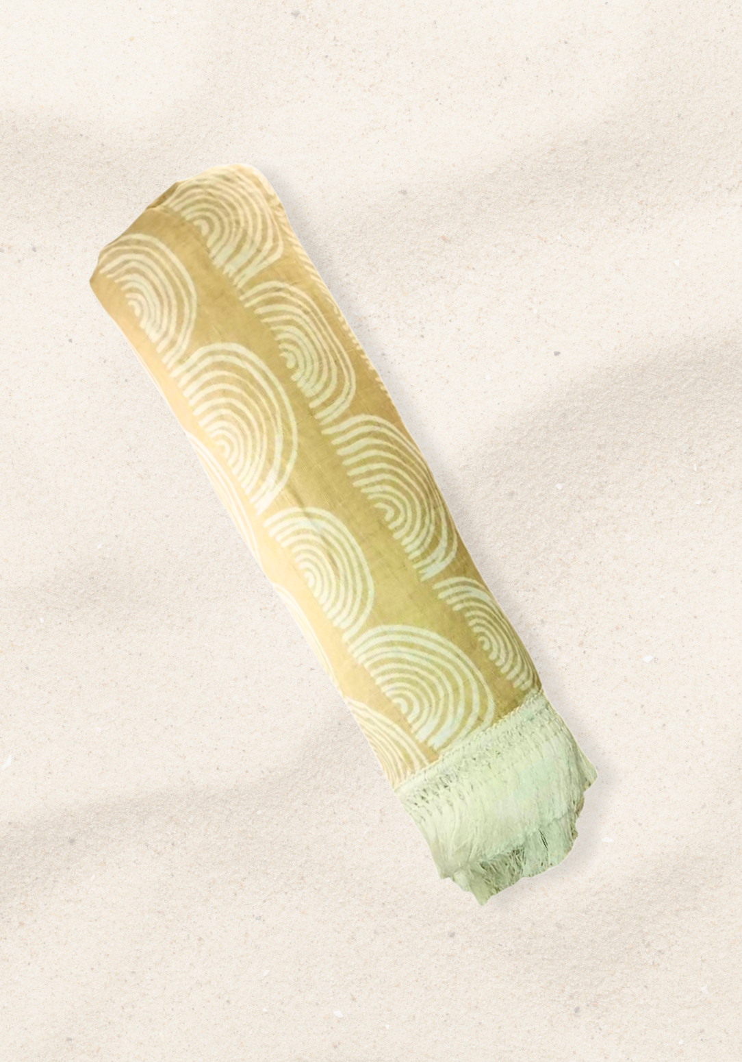 Rolled light beige baby blanket with white arched rainbow patterns and fringe edges. Soft cotton-bamboo blend perfect for newborns.