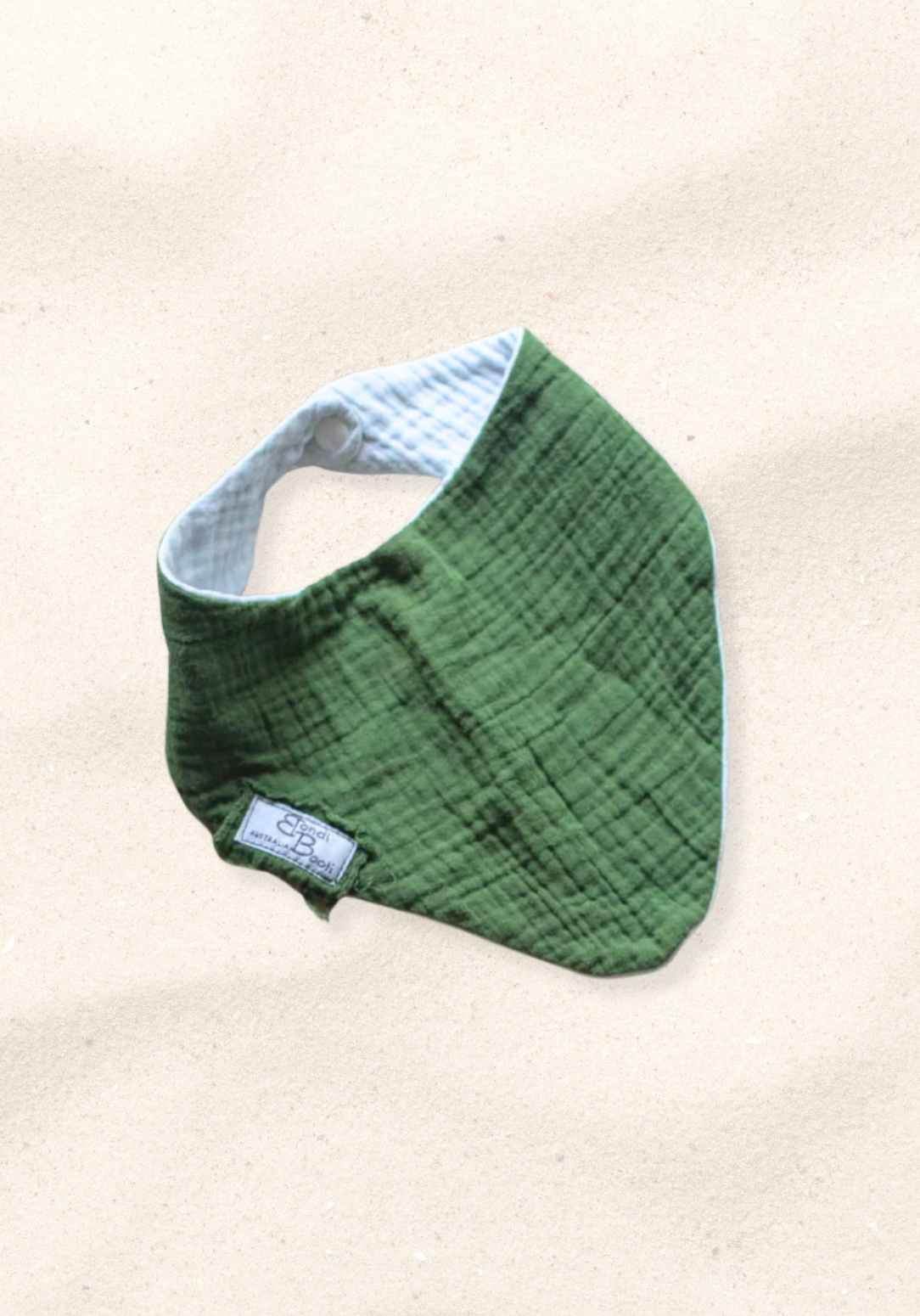 Deep green bandana-style baby bib made from soft organic cotton with absorbent inner lining.