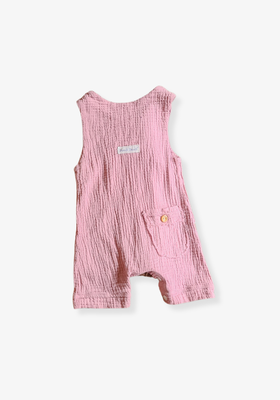 Dusty pink organic cotton baby overall onesie with wooden button shoulder straps and soft elastic leg openings
