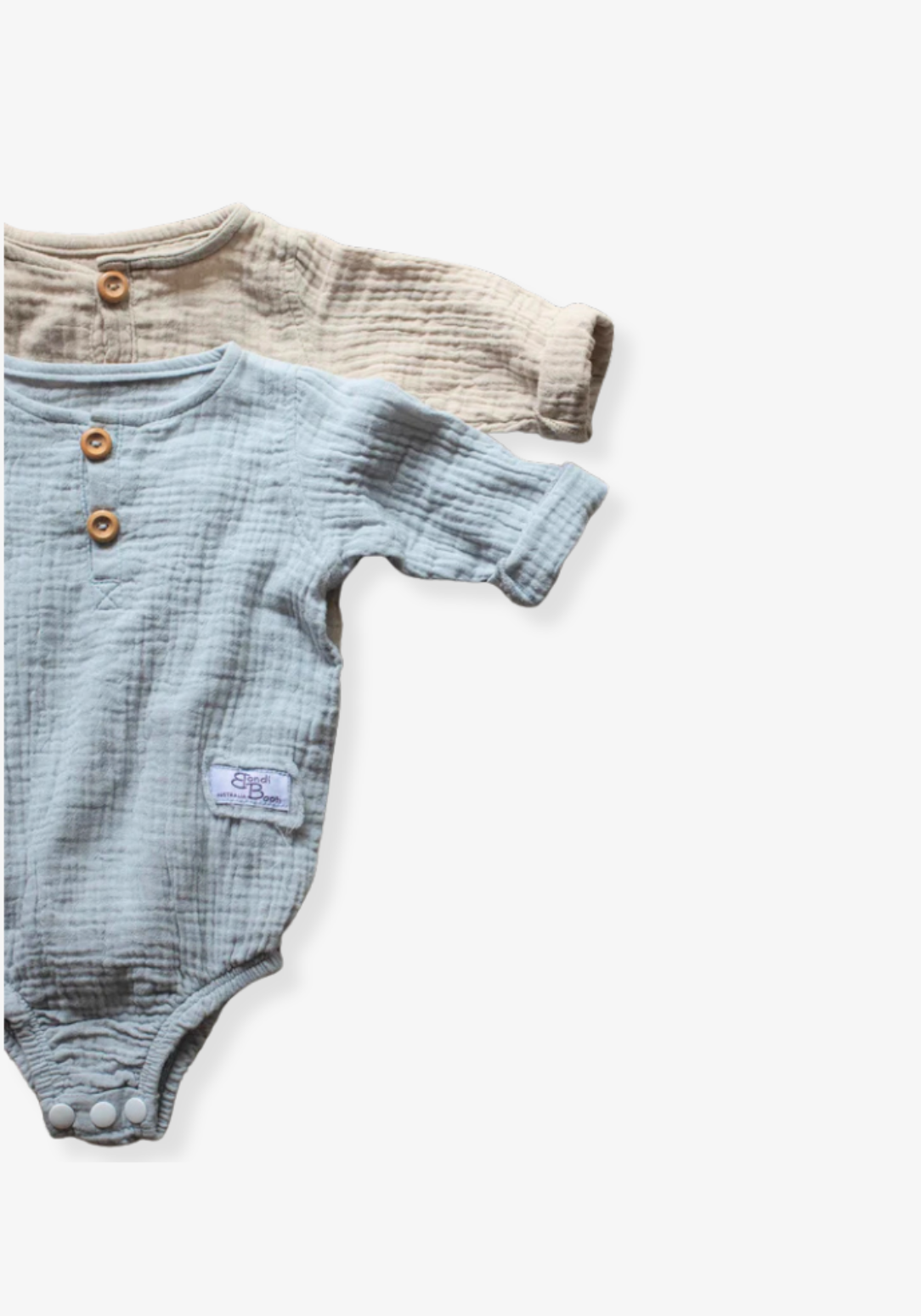 French grey long sleeve baby romper made from soft organic cotton with wooden button front and snap closures.