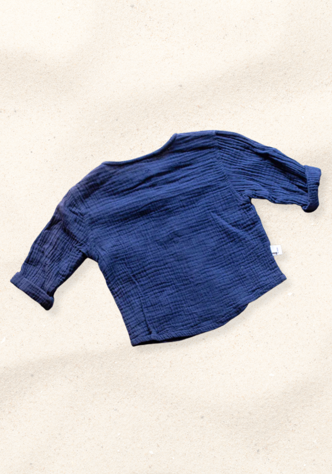 Navy island-style baby and toddler shirt made from organic cotton with wooden buttons and short sleeves