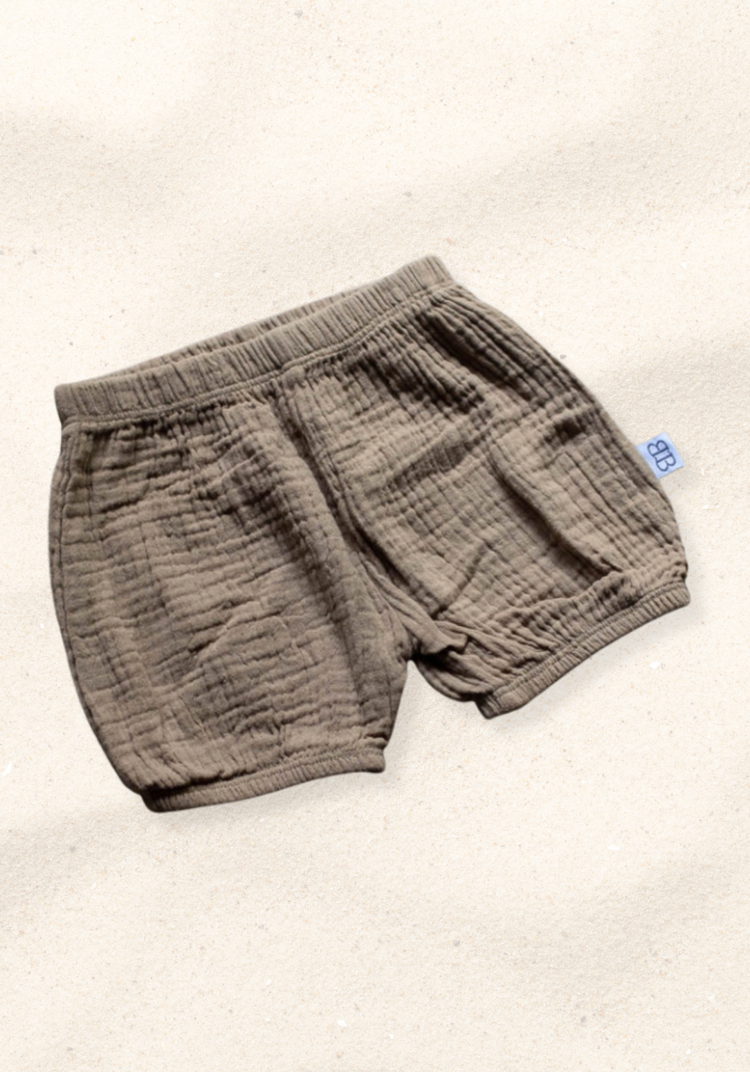 Mocha organic cotton baby bloomers with soft elastic waistband and leg openings, perfect for warm weather