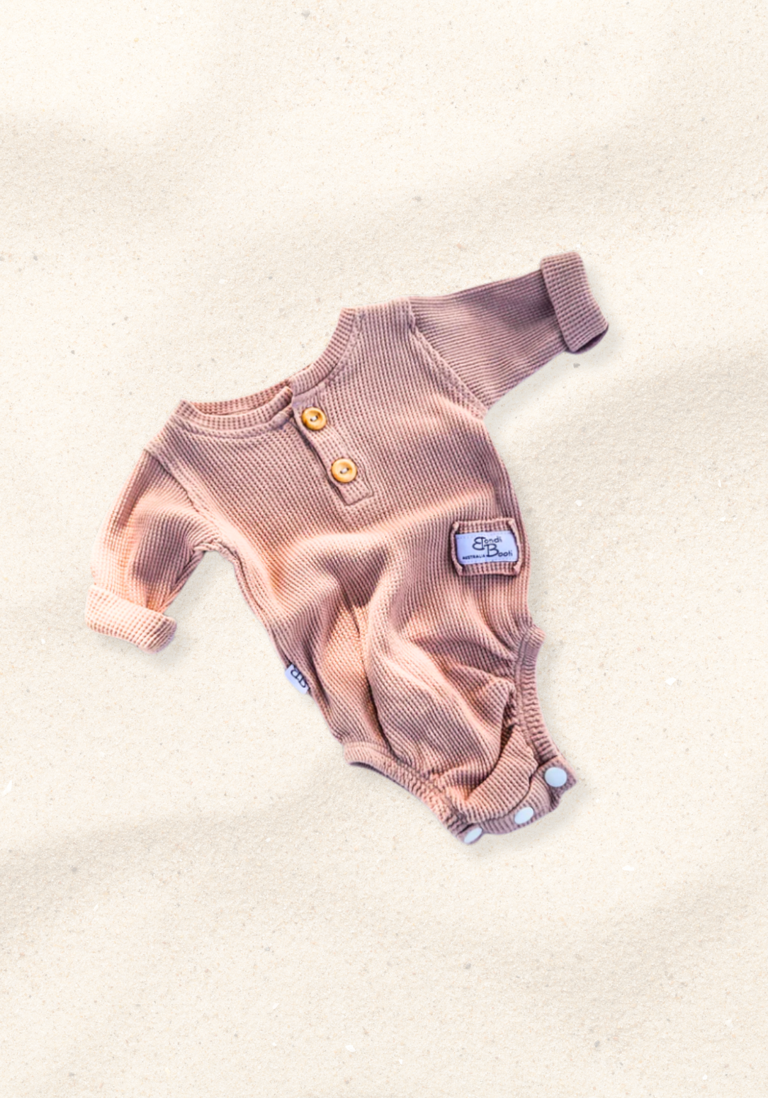 waffle knit long sleeve baby bodysuit with soft organic cotton texture and convenient snap buttons