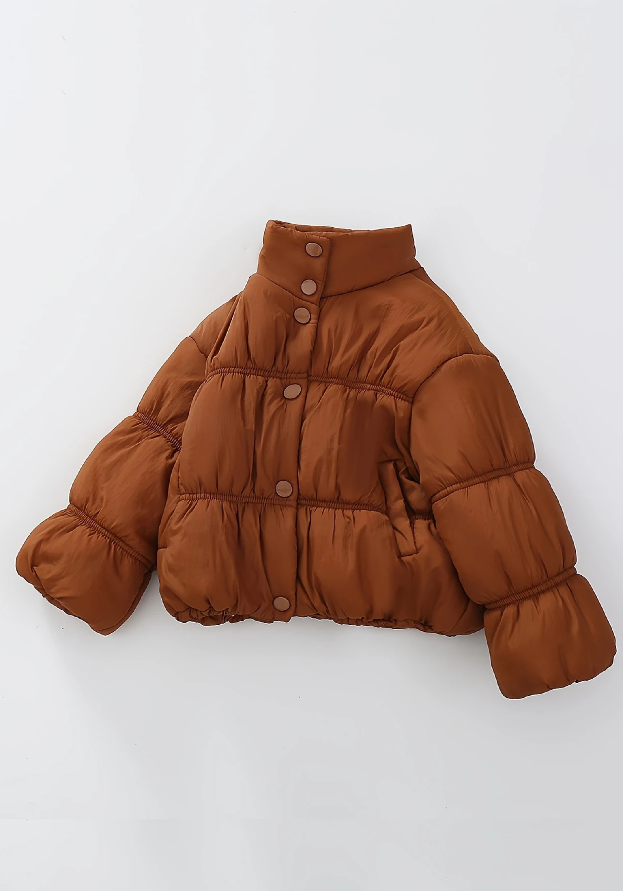 Front view of toddler brown puffer jacket with ruched detailing and high collar