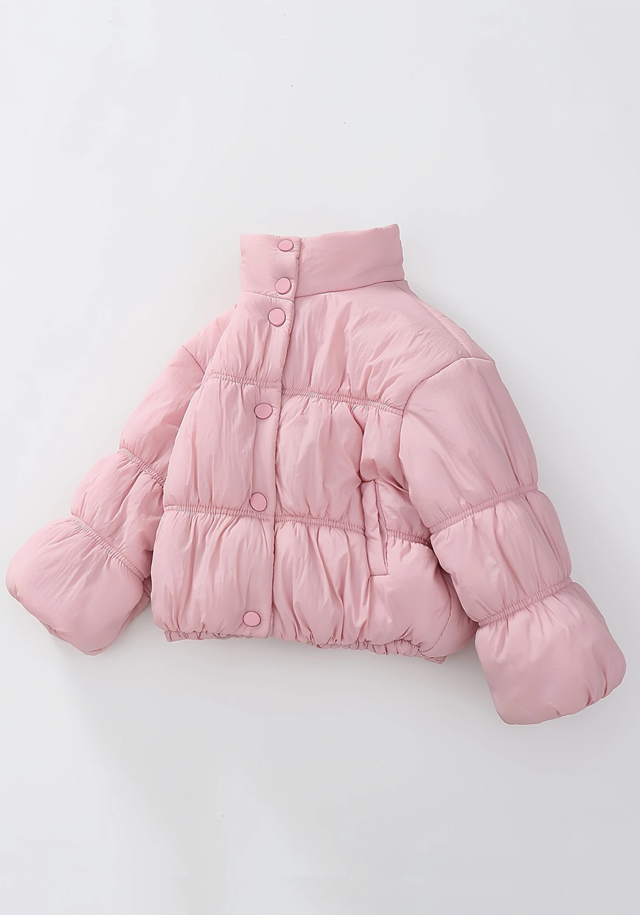 Front view of toddler pink puffer jacket with ruched detailing and high collar