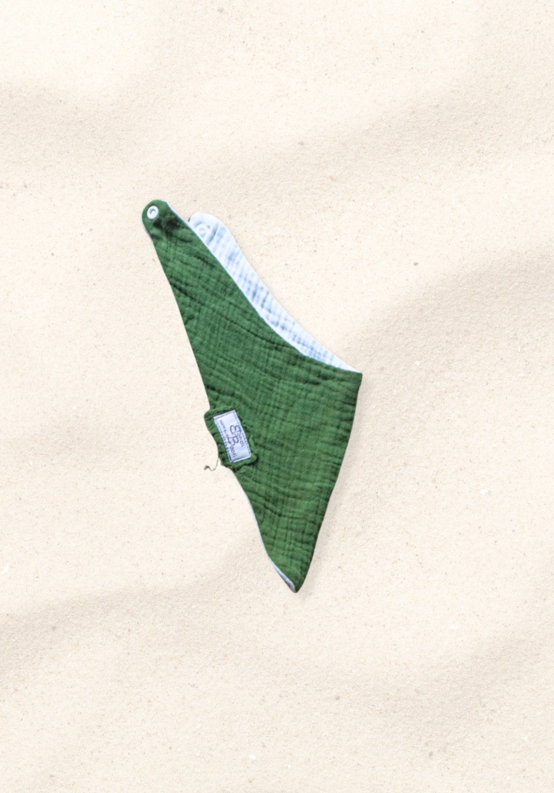 Deep green bandana-style baby bib made from soft organic cotton with absorbent inner lining.