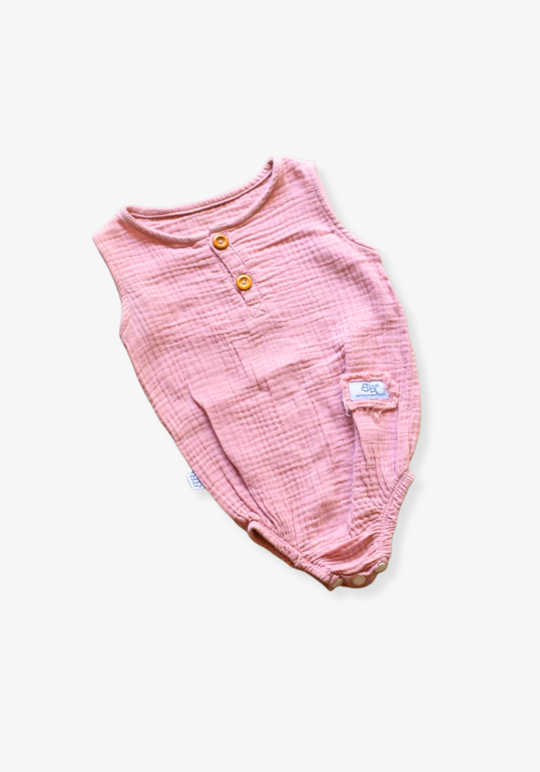 Organic cotton baby romper in dusty pink with snap buttons at the bottom and elasticised leg bands.