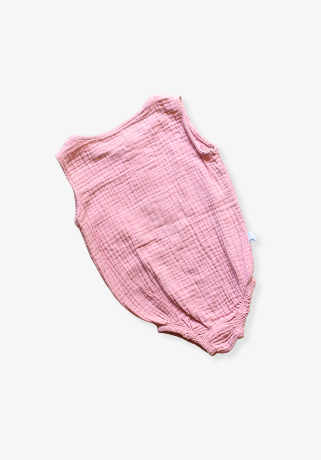 Organic cotton baby romper in dusty pink with snap buttons at the bottom and elasticised leg bands.