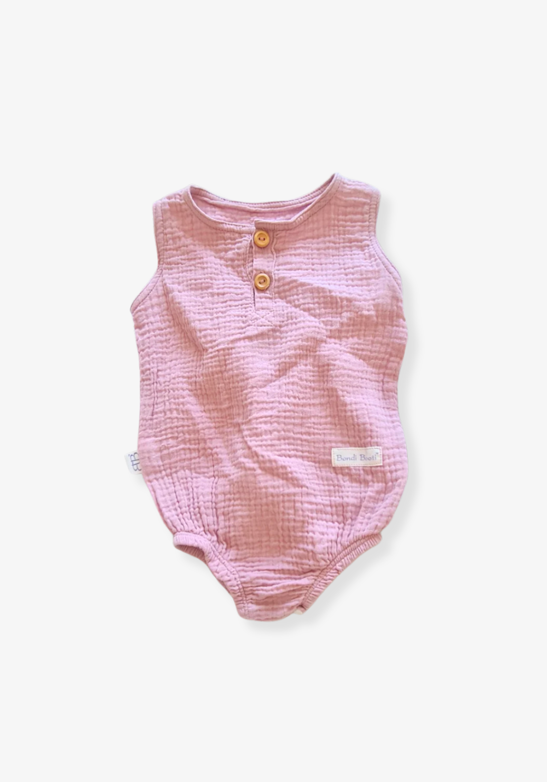 Organic cotton baby romper in dusty pink with snap buttons at the bottom and elasticised leg bands.