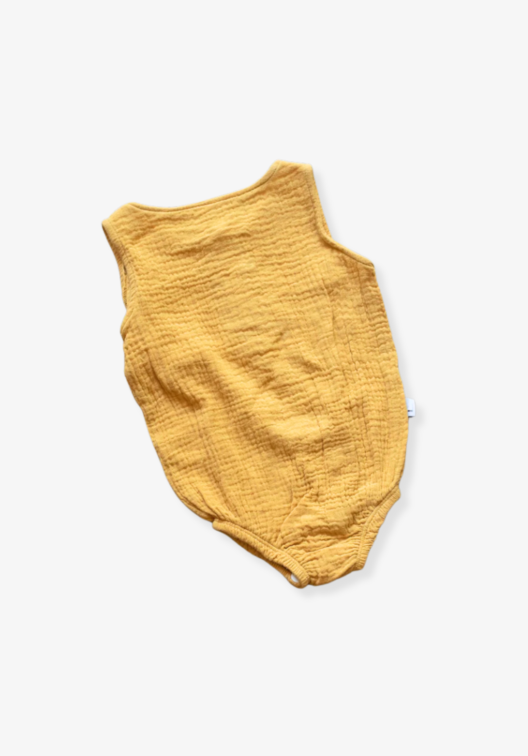 Mustard short sleeve organic cotton baby romper with three snap buttons at the bottom and elasticised leg bands