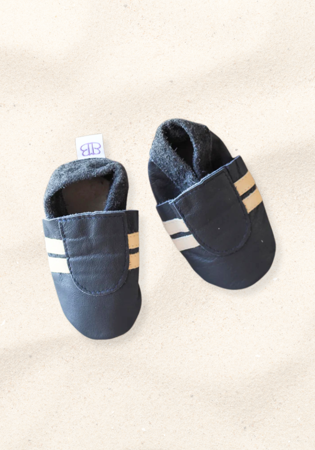 Leather soft sole baby booties in navy and cream with elastic ankle and non-slip suede soles