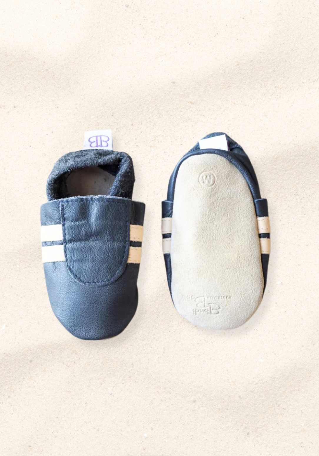 Leather soft sole baby booties in navy and cream with elastic ankle and non-slip suede soles