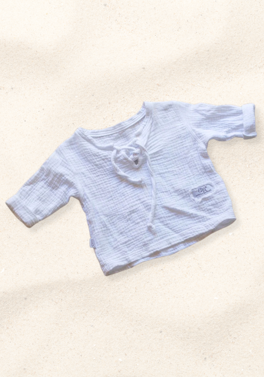 The Pirate Shirt in white made from organic cotton with wooden buttons, perfect for toddler casual wear