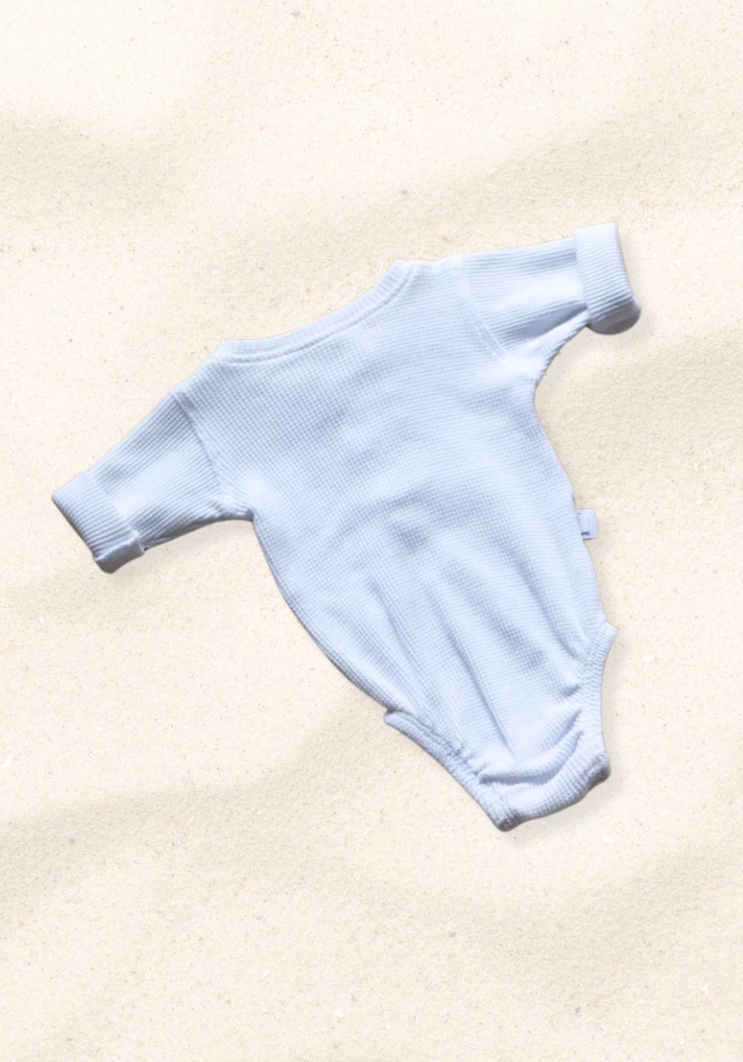 waffle knit long sleeve baby bodysuit with soft organic cotton texture and convenient snap buttons