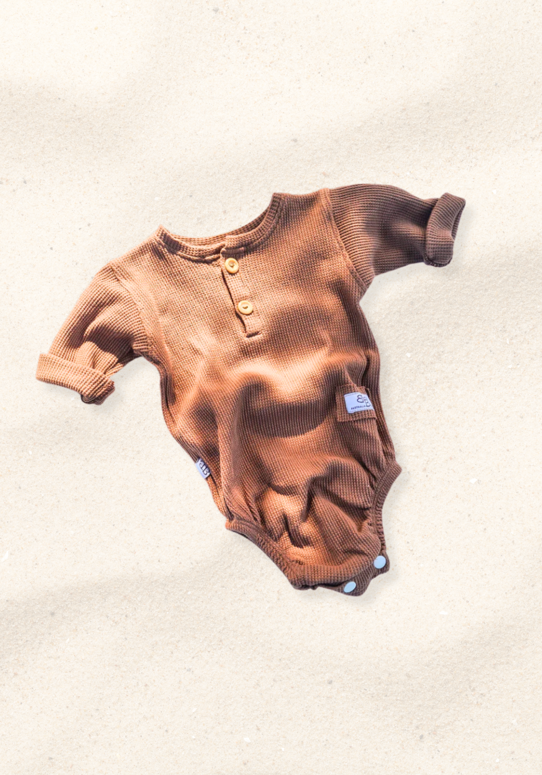 waffle knit long sleeve baby bodysuit with soft organic cotton texture and convenient snap buttons